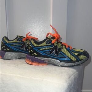 New Balance Kids' Black and Blue Sneakers with Orange Accents